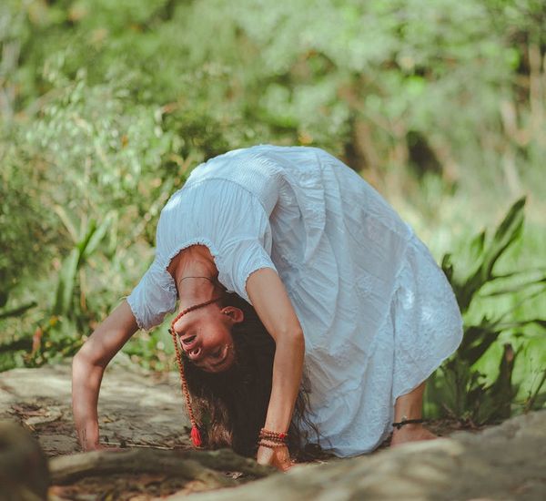 Person meditating peacefully in a serene environment.